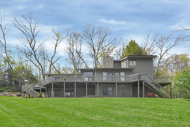 rear view of property with stairs, a lawn, and a chimney