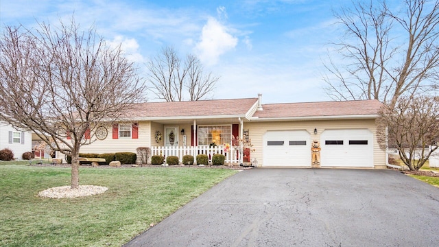 ranch-style home featuring a garage, a porch, aphalt driveway, and a front yard