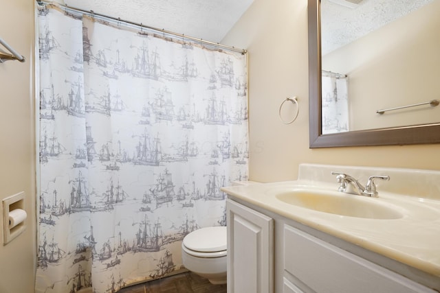 bathroom featuring curtained shower, a textured ceiling, vanity, and toilet