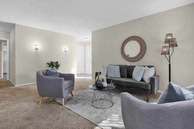 living area featuring carpet and baseboards