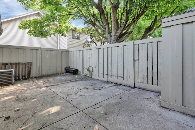 view of patio / terrace featuring central AC unit and a fenced backyard