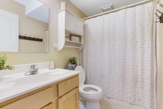 bathroom with visible vents, a shower with shower curtain, toilet, vanity, and tile patterned floors