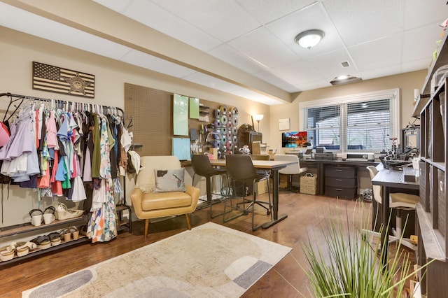 office featuring a paneled ceiling and wood finished floors