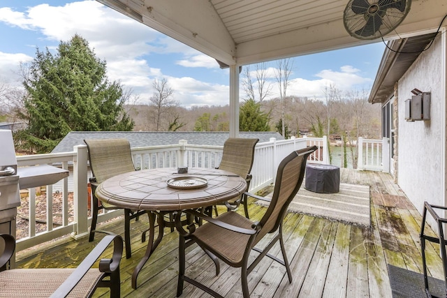 wooden terrace featuring outdoor dining space