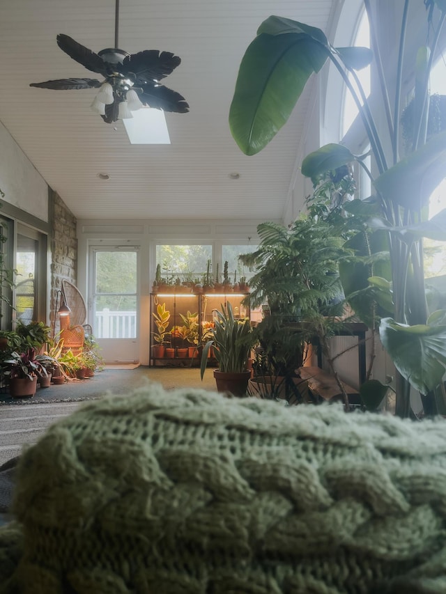 sunroom featuring lofted ceiling