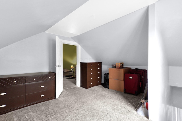 bonus room featuring carpet flooring and vaulted ceiling