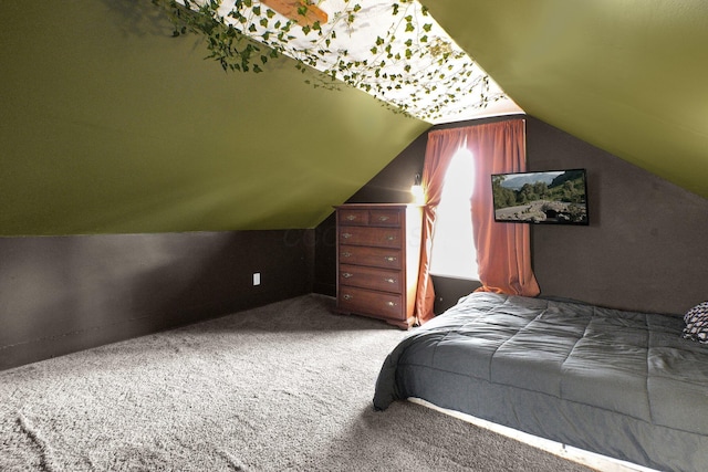 carpeted bedroom with vaulted ceiling