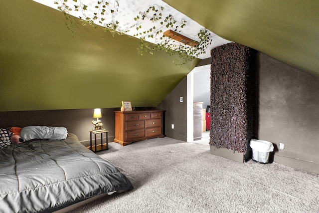 carpeted bedroom with vaulted ceiling