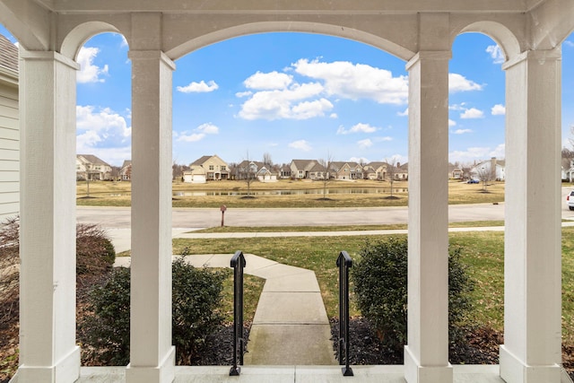 view of patio with covered porch and a residential view