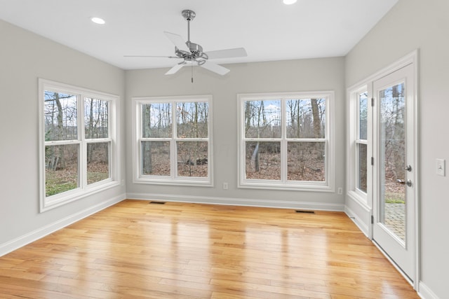 unfurnished sunroom with visible vents