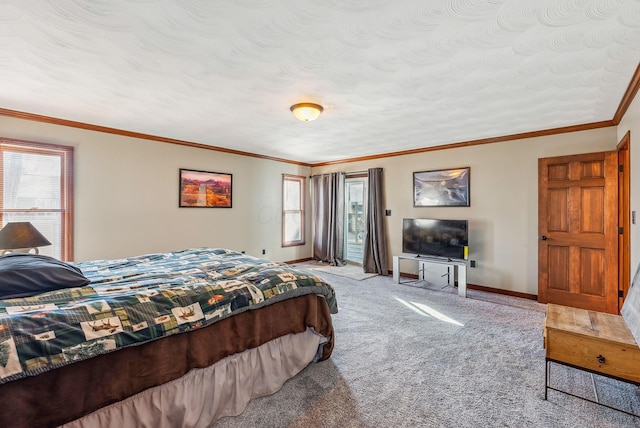 bedroom featuring baseboards, a textured ceiling, ornamental molding, and carpet flooring