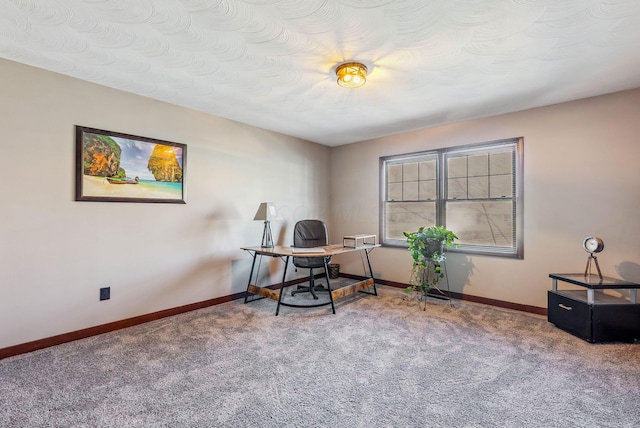 carpeted office with baseboards