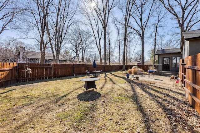 view of yard with a fenced backyard and a patio area