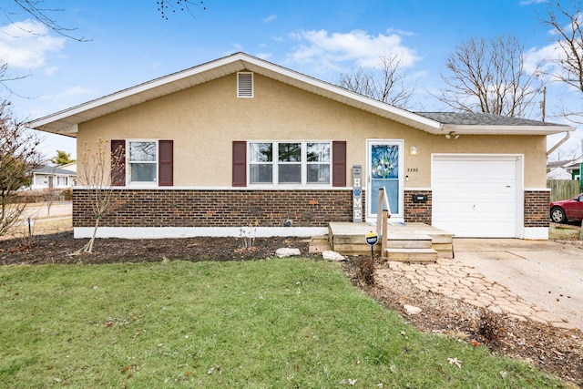 ranch-style home with brick siding, concrete driveway, an attached garage, a front lawn, and stucco siding