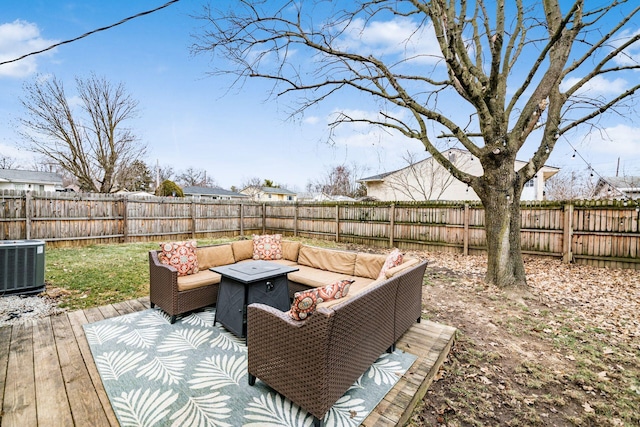 deck featuring cooling unit, a fenced backyard, and an outdoor living space