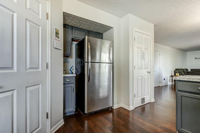 3093 Briar Ridge Rd, Columbus, OH 43232 - kitchen featuring gray cabinetry, open floor plan, dark wood-type flooring, and freestanding refrigerator