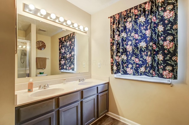 3093 Briar Ridge Rd, Columbus, OH 43232 - bathroom featuring double vanity, a sink, visible vents, and a shower with door
