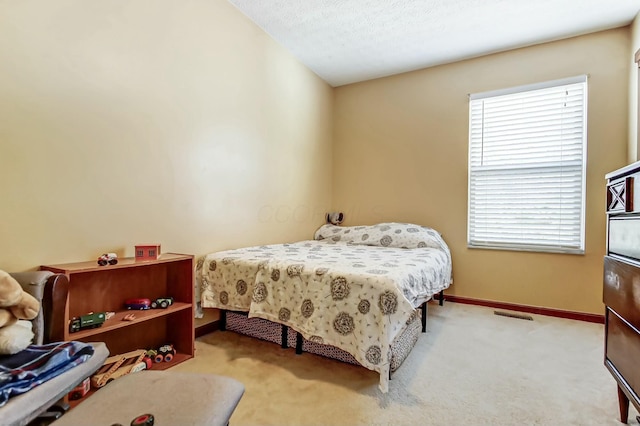 3093 Briar Ridge Rd, Columbus, OH 43232 - bedroom featuring a textured ceiling, carpet floors, visible vents, and baseboards