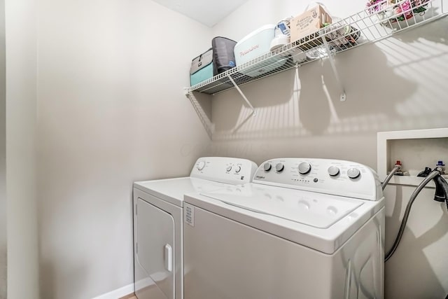 laundry area with laundry area and washer and clothes dryer