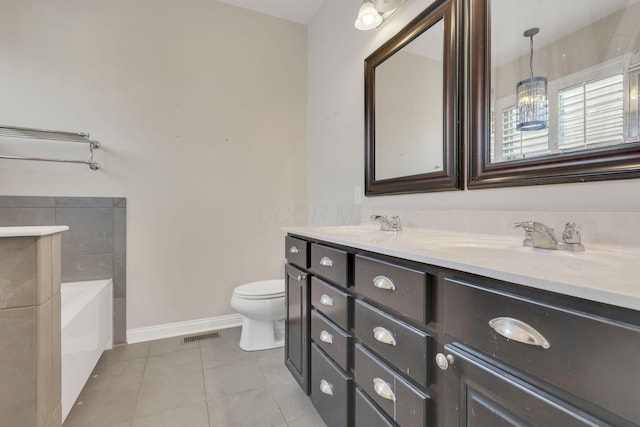 full bath featuring double vanity, baseboards, toilet, tile patterned flooring, and a sink