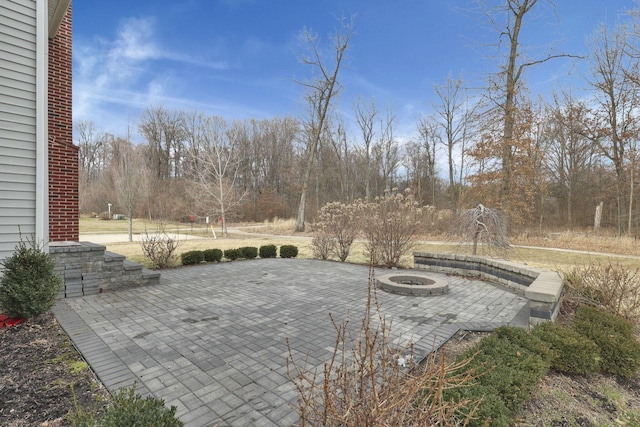 view of patio featuring a fire pit