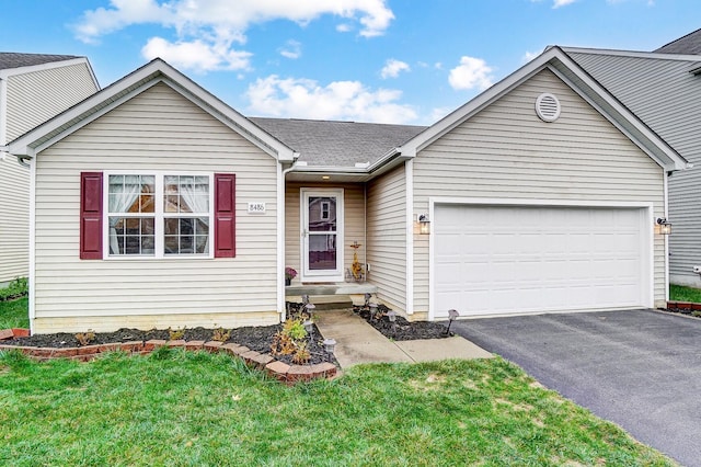 single story home featuring driveway and a garage