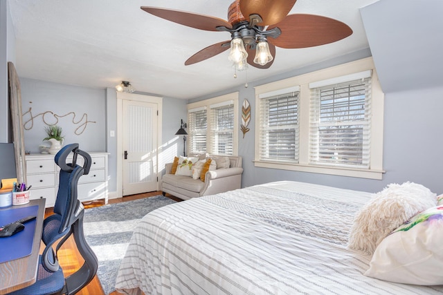 bedroom with ceiling fan and wood finished floors