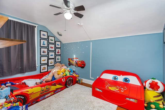 bedroom with baseboards, vaulted ceiling, and a ceiling fan