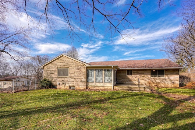 back of property featuring a shingled roof, a lawn, fence, and a patio