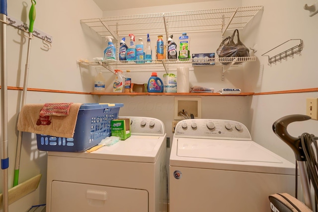 clothes washing area with laundry area and separate washer and dryer