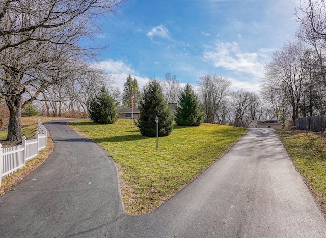 view of street featuring aphalt driveway