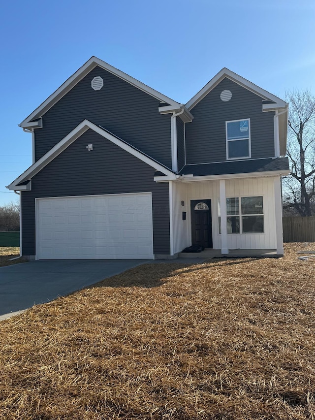 view of front of property featuring concrete driveway