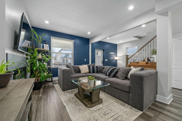 living area featuring stairs, recessed lighting, wood finished floors, and baseboards