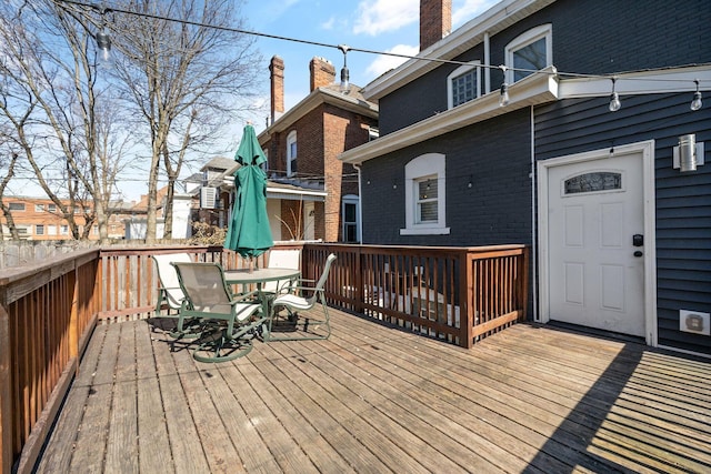 wooden deck with outdoor dining space