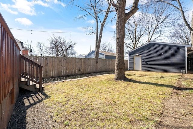 view of yard with an outdoor structure and fence