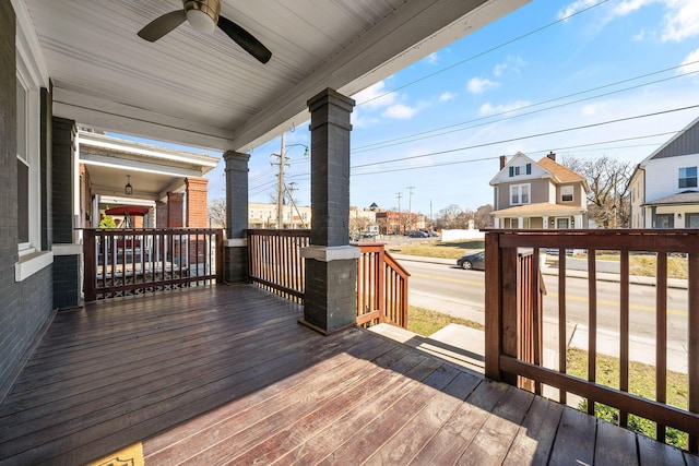 wooden deck featuring a ceiling fan