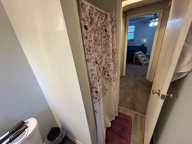 bathroom with a shower with shower curtain