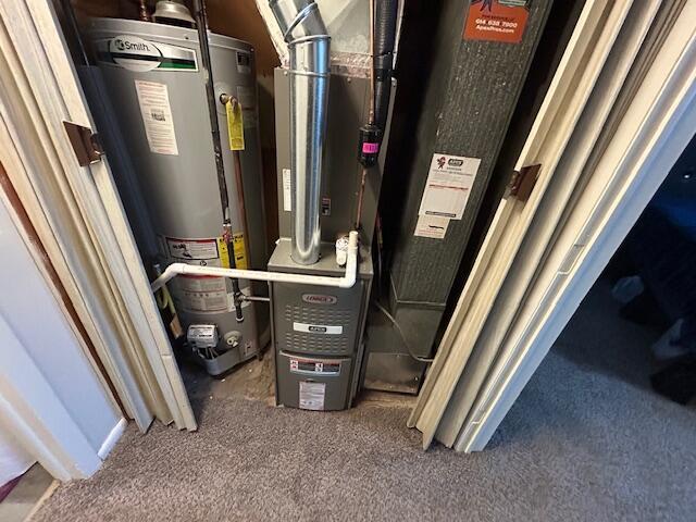 utility room with water heater