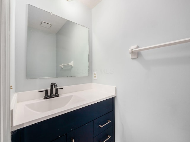 bathroom with visible vents and vanity