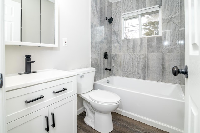 full bath with toilet, shower / washtub combination, wood finished floors, and vanity