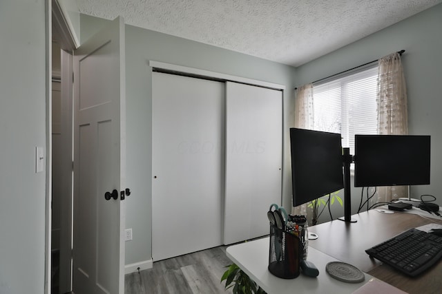 office space featuring a textured ceiling and wood finished floors