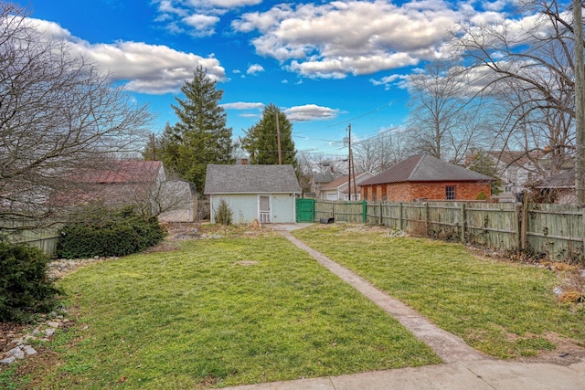 view of yard featuring a fenced backyard and an outdoor structure