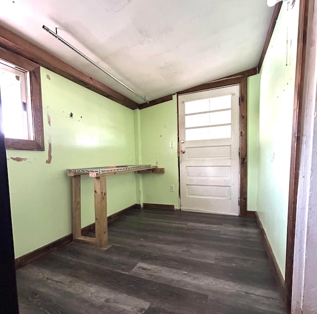 washroom with dark wood-type flooring and baseboards