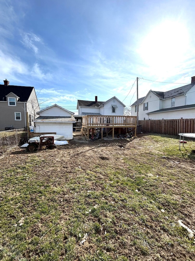 view of yard with fence and a wooden deck