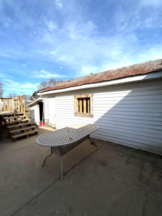 back of house with a patio