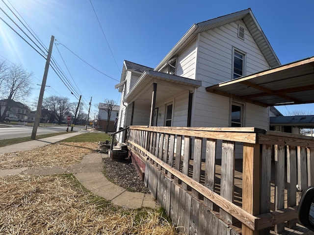 view of property exterior featuring a porch