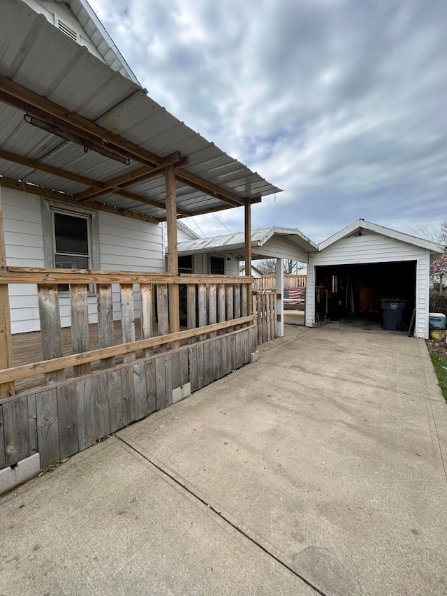 exterior space with a garage and an outdoor structure