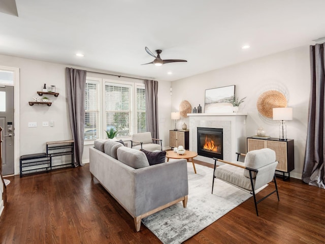 living room featuring recessed lighting, ceiling fan, wood finished floors, and a glass covered fireplace