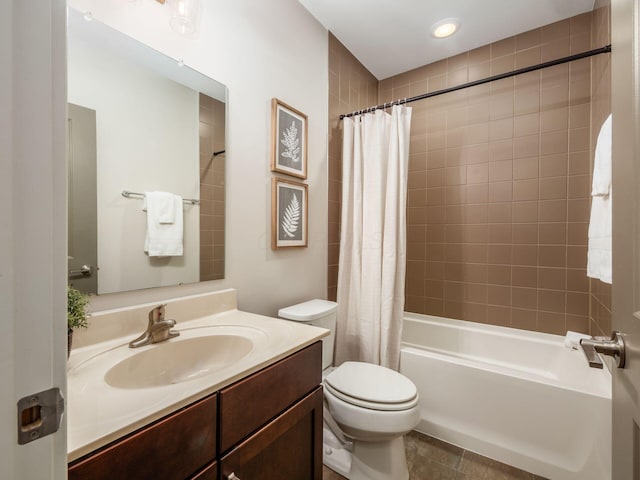 bathroom with toilet, shower / tub combo, and vanity