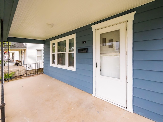 doorway to property featuring covered porch